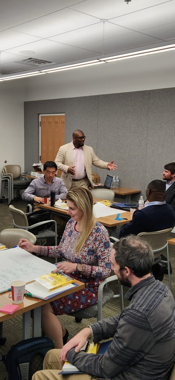 Alex D. Tremble facilitating a working session with a leadership team